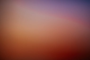 Warm orange gradient background with smooth transitions to deep red and brown tones, evoking a cozy, autumnal, and energetic abstract feel.