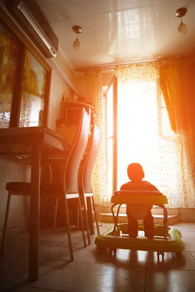 Little boy in baby walkers in the room — Stock Photo, Image