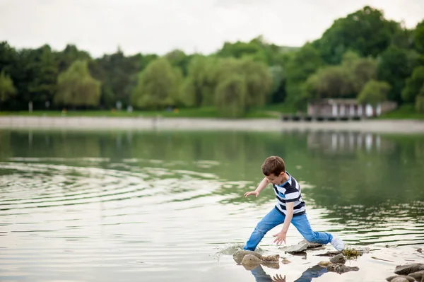 Boy, funny, naughty, fall, stumble, wet, lake, water, danger, lose balance, kid — Stock Photo, Image