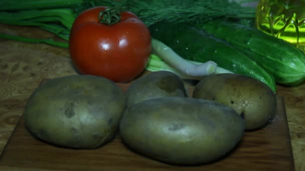 Hot potatoes. Vegetables for salad — Stock Video