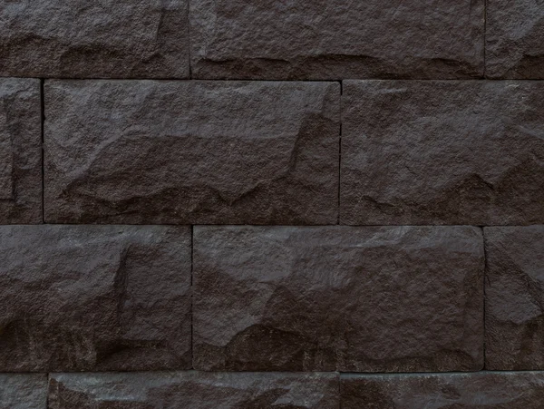Hintergrund aus dunkelbraunem Stein — Stockfoto