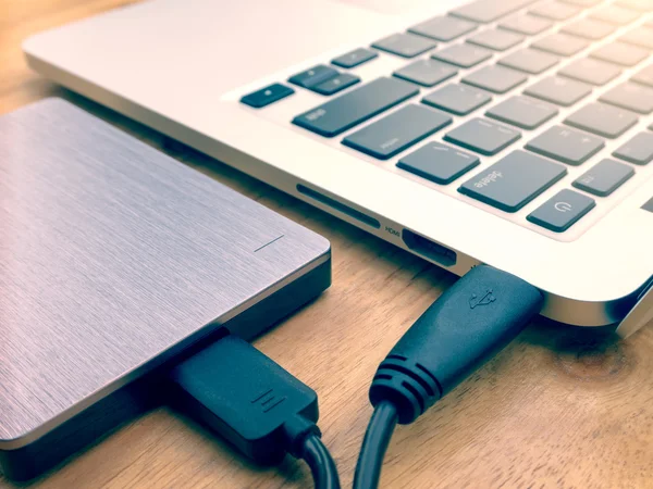 External hard drive connected to laptop computer — Stock Photo, Image