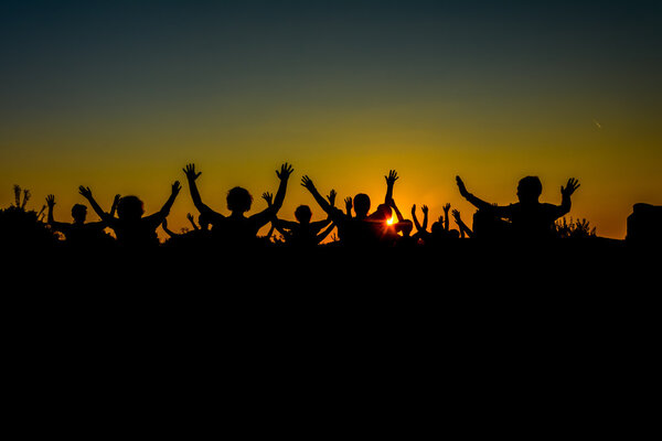 People welcoming sun