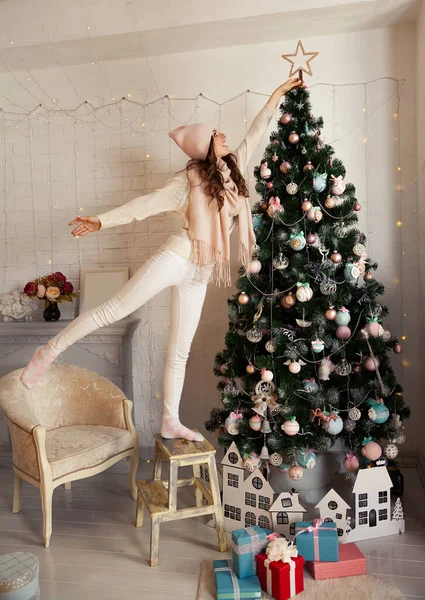 Happy Young Woman Decorates Christmas Tree Girl Sweater Sets Star — Stock Photo, Image