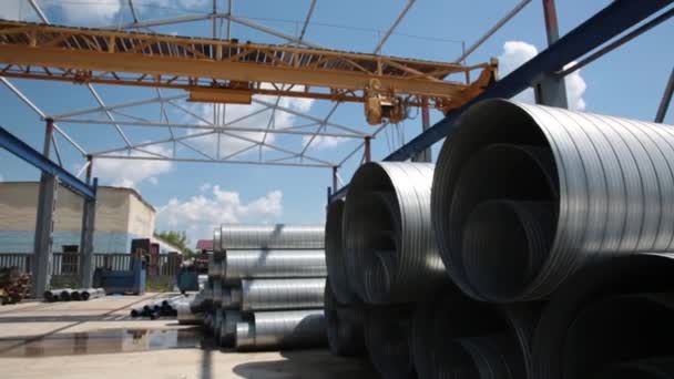 Ventilation pipe warehouse. Steel pipes, parts for the construction of air ducts for an industrial air conditioning system in a warehouse. Industrial airway ventilation equipment and piping systems — Stock Video