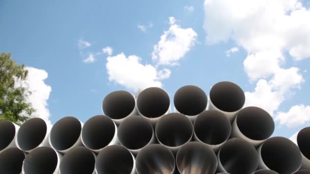 Downpipe warehouse. Steel pipes, parts for the construction of a roof drainage system in a warehouse. Stack of stainless steel pipes. — Stock Video