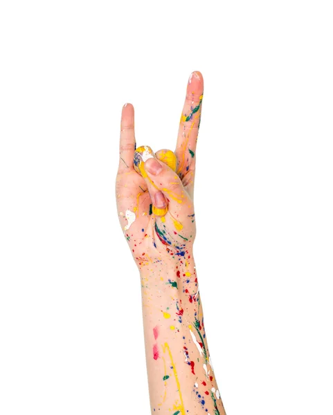 Mujer mano en pintura haciendo señal de los cuernos (rockeros ) — Foto de Stock