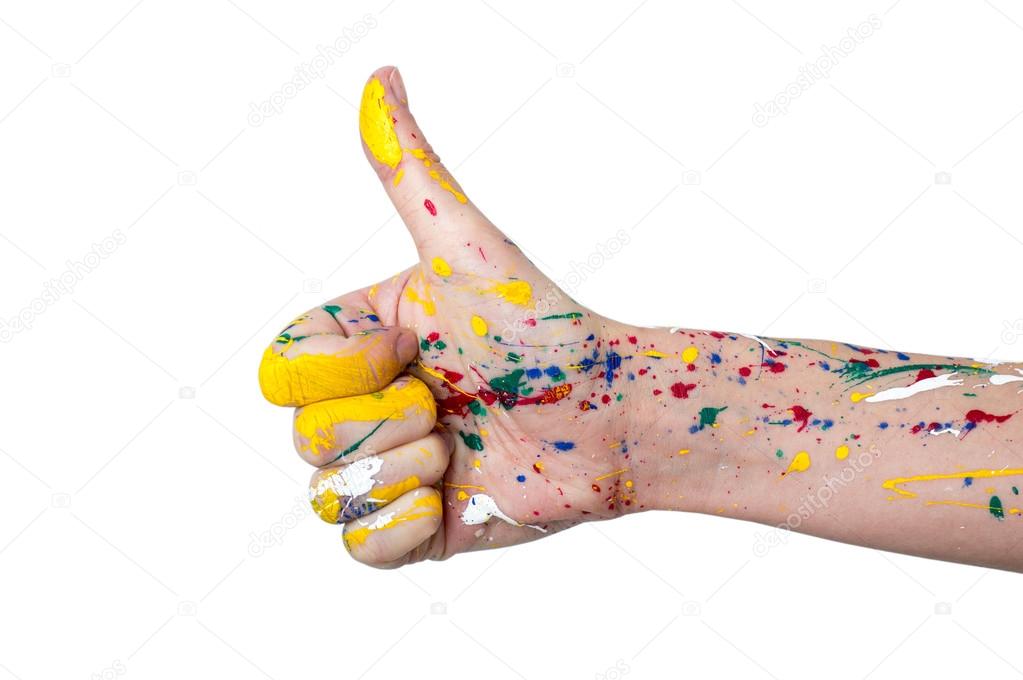 Woman hand in paint with thumb up