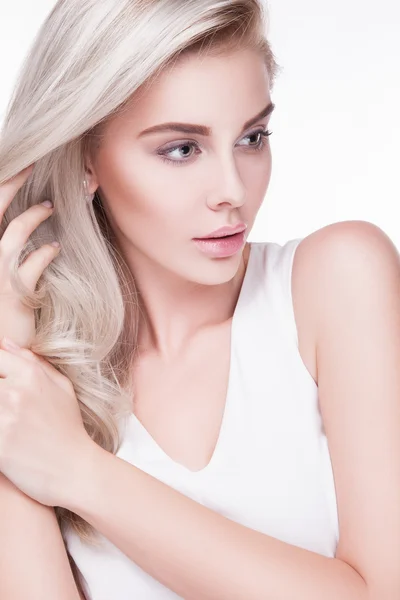 Woman in white dress with earrings — Stock Photo, Image