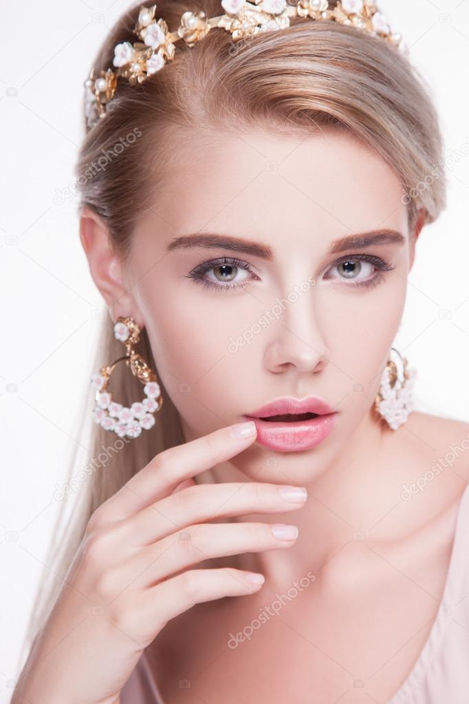 Woman in pink dress with earrings