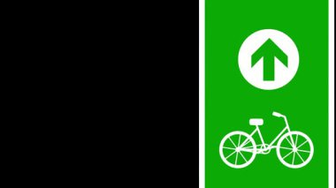 Yeşil dikdörtgen işareti yukarı doğru beyaz bir ok ve bisikletçiler için belirlenmiş bir şerit veya yolu gösteren bir bisiklet ikonu içerir.