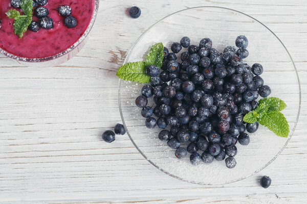 Delicious bilberry smoothie with fresh berries. Fresh yogurt wit