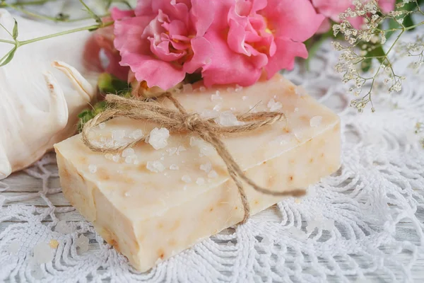 Natural handmade soap, aromatic oil and flowers on white wooden — Stock Photo, Image