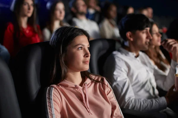 Young girl enjoying free time in movie theater. — Stock Photo, Image