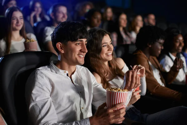 Caucasian couple laughing in movie theater. — Stock Photo, Image