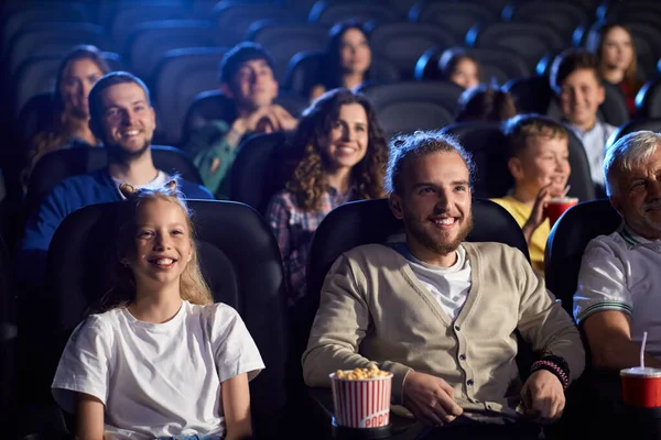 Young man with younger sister in cinema. — Stock Photo, Image