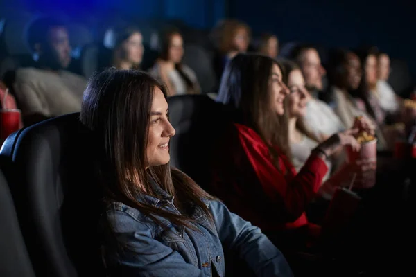 Young girl spending weekend in movie theater. — Stock Photo, Image