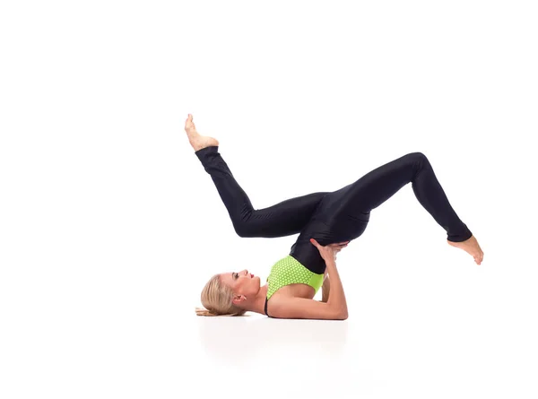 Attractive female gymnast exercising at studio — Stock Photo, Image