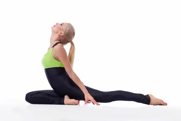 Gorgeous young woman practicing yoga sitting on the floor — Stock Photo, Image