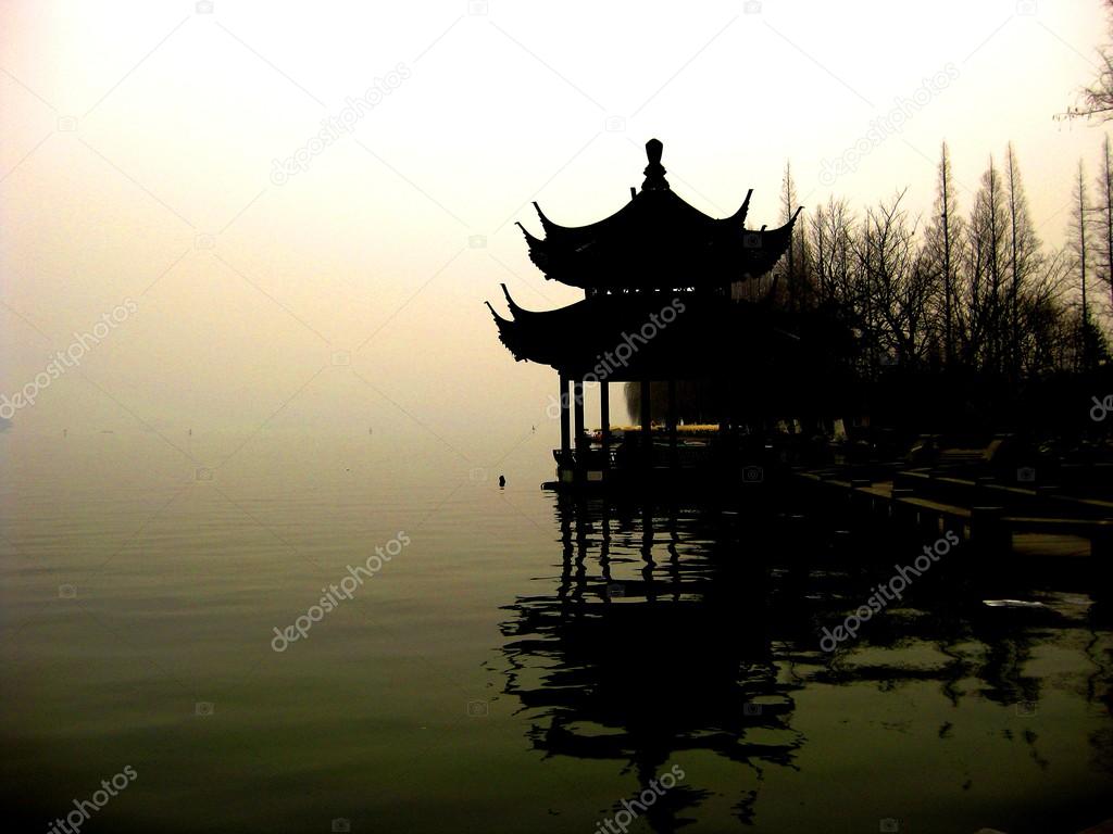 Pagoda on misty lake