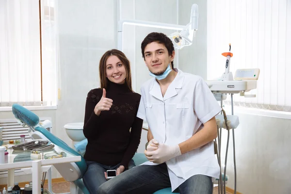 Dentist man with his patient smileing in dental office — Stock Photo, Image