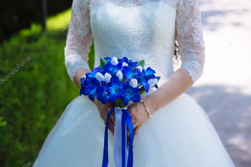 Beautiful Wedding Bouquet With Blue Flowers In Hands Of The Bride Stock Photo Image By C Rmano Mail Ru 122646506