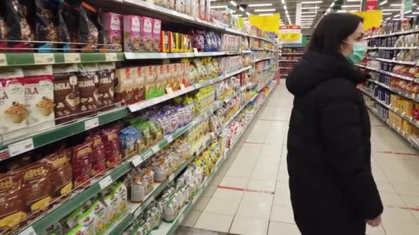 December 2020 Moscow Russia Woman Stands Shelves Goods Trying Choose — Stock Video