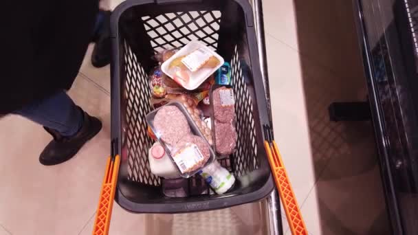 Supermarket Shoppers Put Groceries Trolley — Stock Video