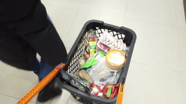 Supermarket Shoppers Put Groceries Trolley — Stock Video