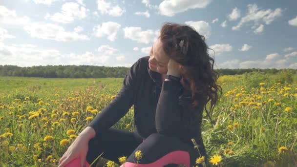 Girl Sits Spring Meadow Overgrown Flowering Dandelions Portrait Woman Selects — Stock Video