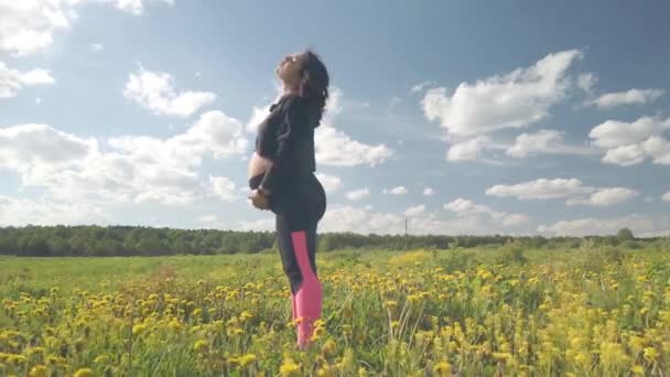 Pregnant Girl Blooming Field Does Sports — Stock Video