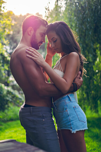 Couple hugging and caressing in the park
