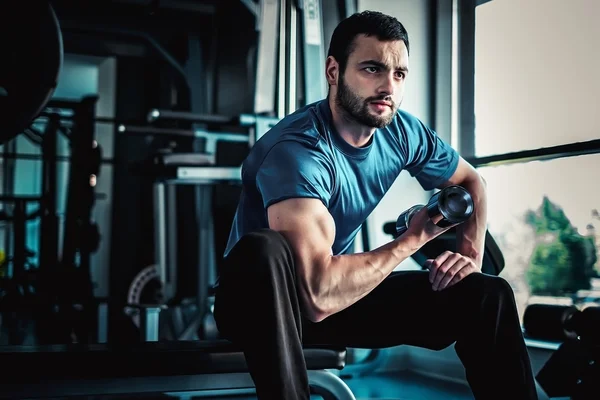 Concentrated man workout biceps — Stock Photo, Image