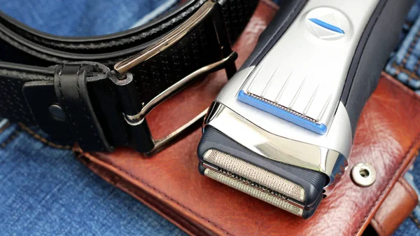 Electric shaver, wallet and a leather belt, beauty