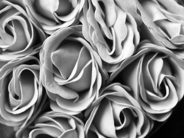 Soap in the shape of a flowers so close, black and white