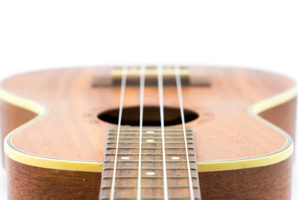 Częścią tle ukulele brązowy — Zdjęcie stockowe