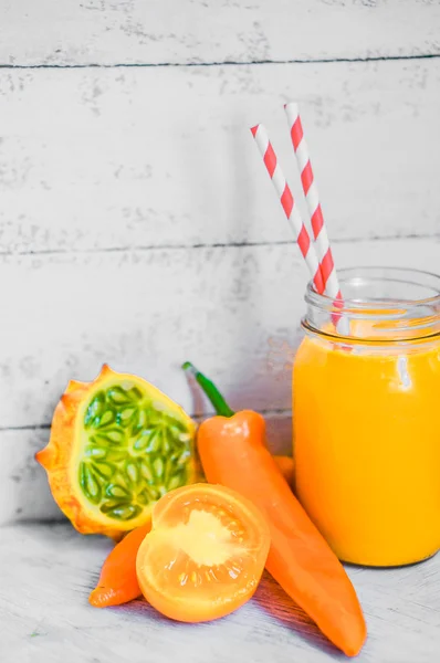 Orange smoothie on rustic background — Stock Photo, Image