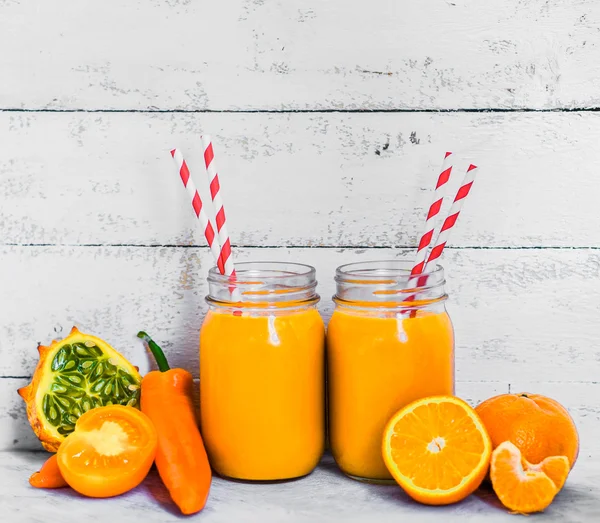Orange smoothie on rustic background — Stock Photo, Image