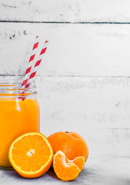 Orange smoothie on rustic background — Stock Photo, Image