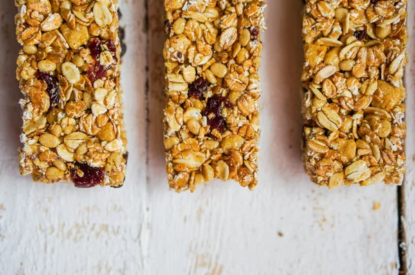 Granola bars on wooden background — Stock Photo, Image