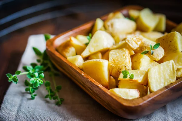 Baked potatoes on wooden background — Stock Photo, Image