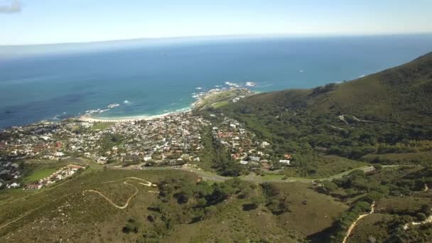 Cape Town city 4K UHD aerial footage of Camps Bay & Lions Head mountain peak. Part 1 of 3 — Stock Video