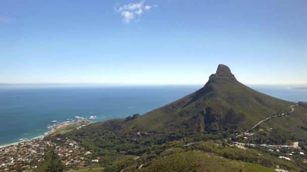 Cape Town city 4K UHD aerial footage of Lions Head mountain peak and Camps Bay Beach — Stock Video