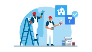 Profesyonel ressamlar bir konut odasının duvarlarını boyuyor.