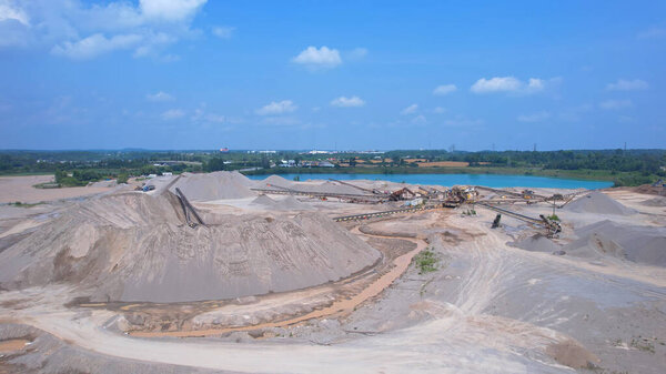 Canadian landscape of rare earth mining site. Critical rare earth minerals used for technology, weapon and electric vehicles. Concept of industry, nature, and environmental impact.