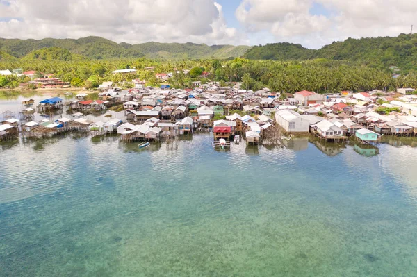Dapa, Siargao, Philippines. Fishing village with wooden houses, standing on stilts in the sea, top view. Landscape in the Philippines. — Stock Image Dapa Siargao Philippines Fishing Village Wooden Houses Standing Stilts Sea Royalty Free Stock Photos