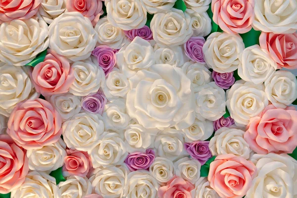 Background Texture of Artificial Rose. Rose buds made from plastic