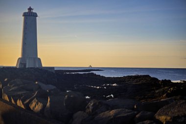 Rocky İzlanda 'da Sunset' teki Deniz Feneri