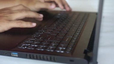 Close up hands typing using laptop computer. Man browsing online working freelance blogger sharing information on pc. Unrecognizable person.