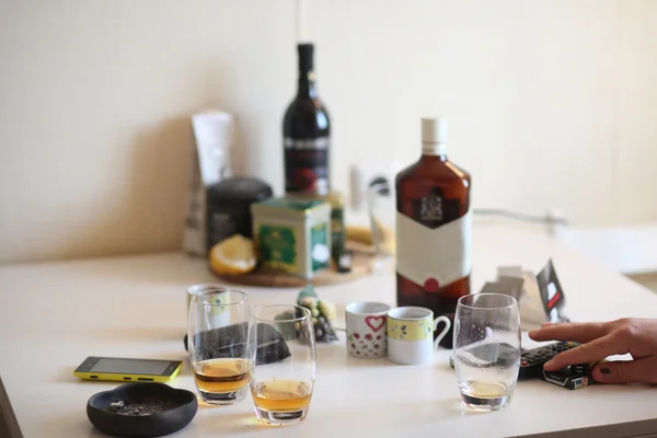 Table with alcohol and glasses. — Stock Photo, Image